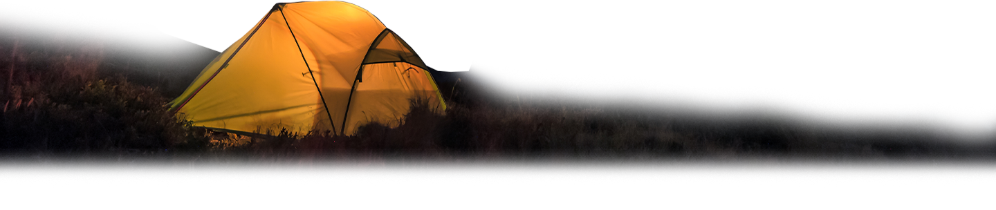 A brightly lit tent on a dark evening