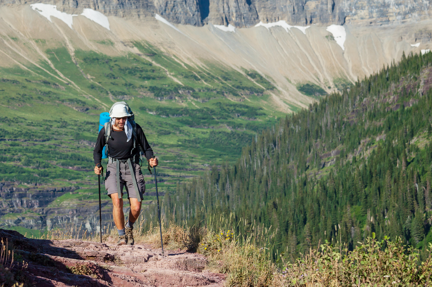 A man hiking on a trail in Montana