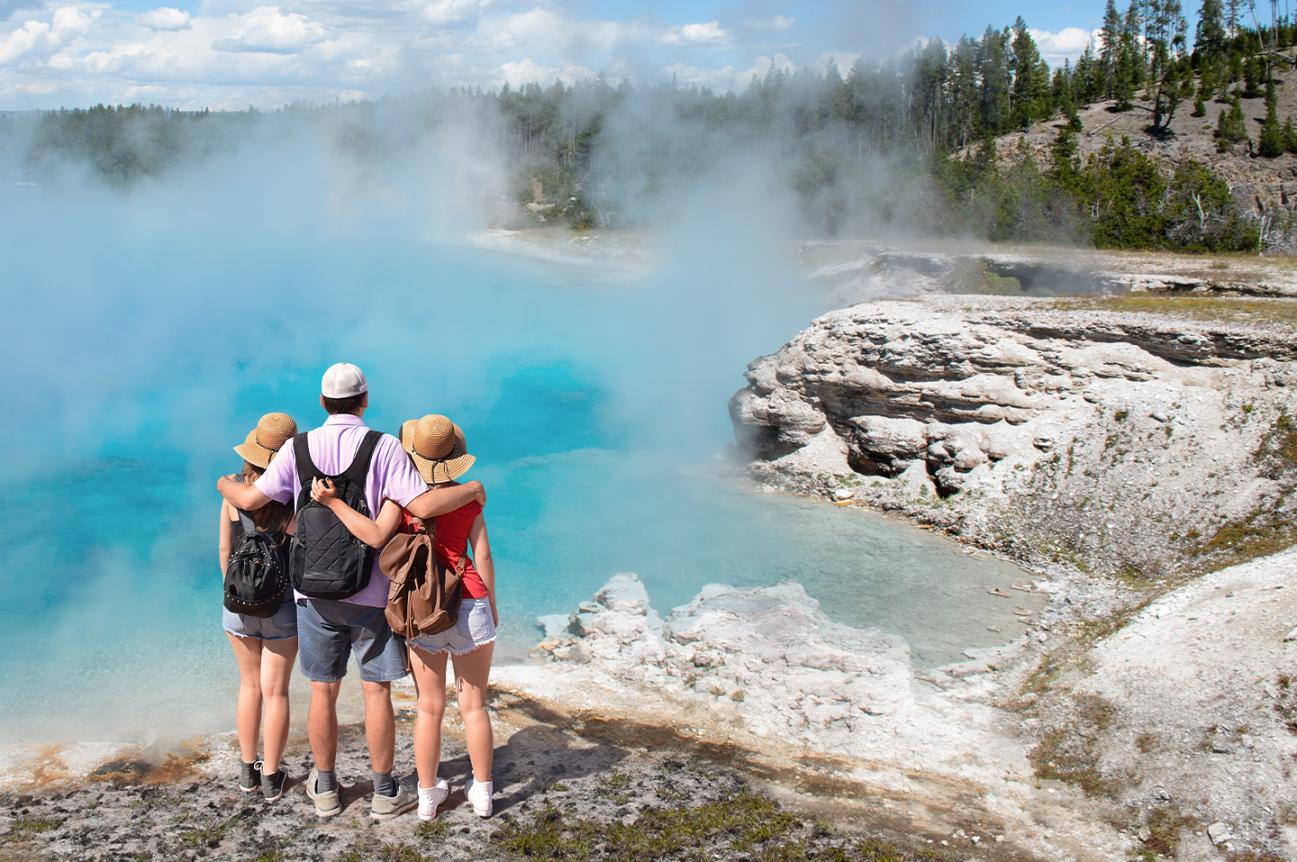 A family overlooking a natural spring in a Californian national park