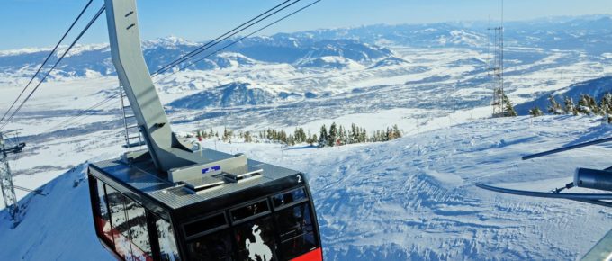 Ski lift cable car moving over snowy mountain in Jackson Hole