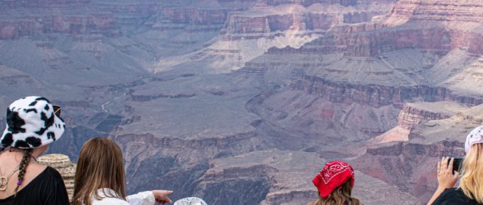Tourists enjoy the view in Grand Canyon, AZ, United States.