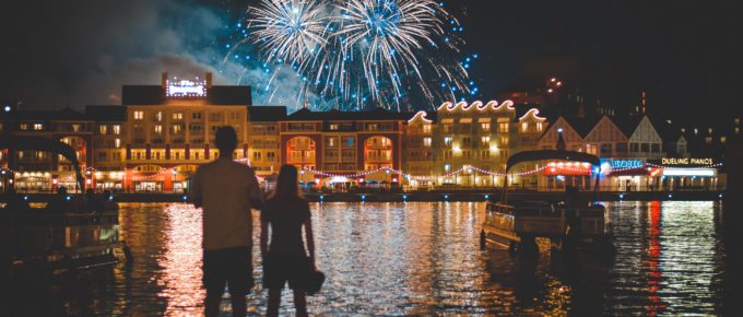 A couple watching the fireworks at Disney World's Deluxe Boardwalk Inn Resort
