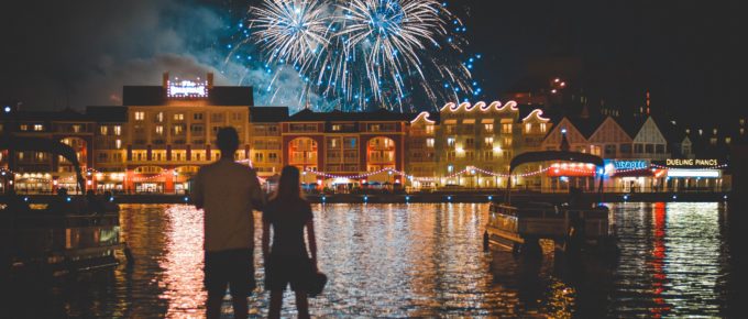 A couple watching the fireworks at Disney World's Deluxe Boardwalk Inn Resort