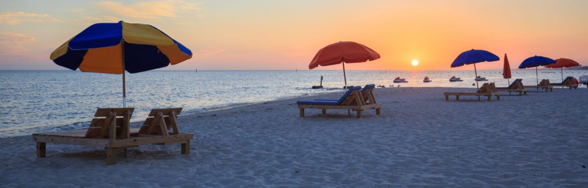 Sunset in Biloxi beach, Mississippi, along Gulf Coast shore.