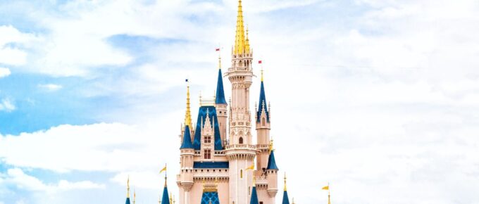 Walt Disney castle under a cloudy sky.