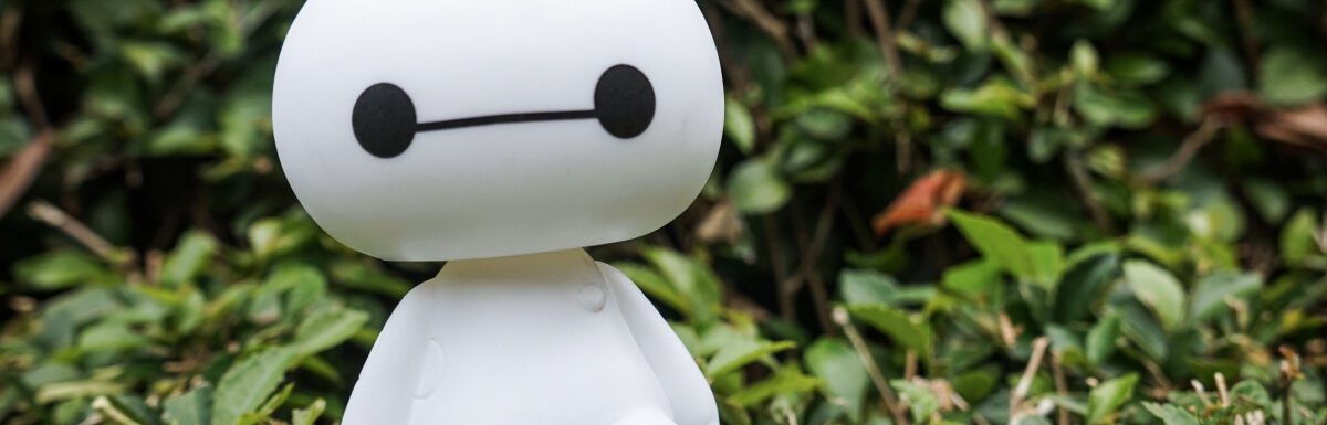 Baymax toy in the bush.