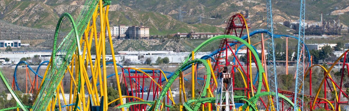 Wide view of colorful roller coaster ride in Six Flags Magic Mountain.