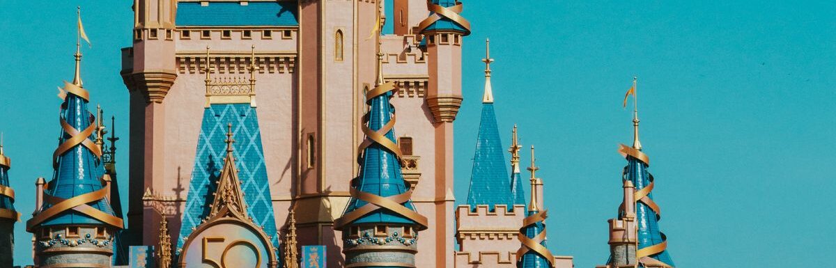 A castle surrounded with many people in Disney World, Orlando, Florida, USA.