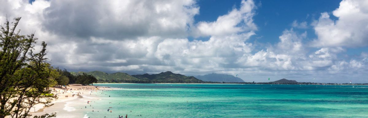 View of Kailua beach in Hawaii with lots of people sunbathing and swimming.