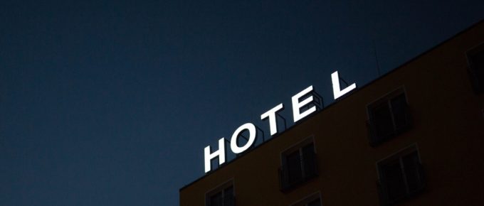 A hotel sign at night.