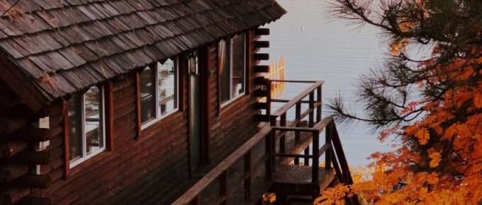 Brown wooden house near the lake during Autumn in Lake Tahoe, United States.