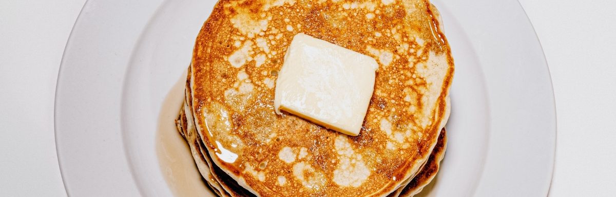 Crispy Golden Brown Pancakes on a white plate.