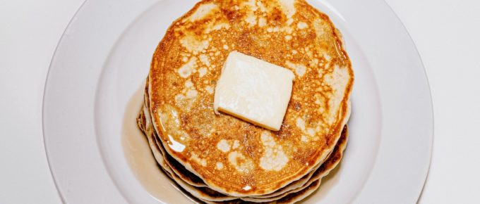 Crispy Golden Brown Pancakes on a white plate.