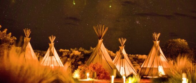 Glamping tents during nighttime in El Cosmico, Marfa, United States.