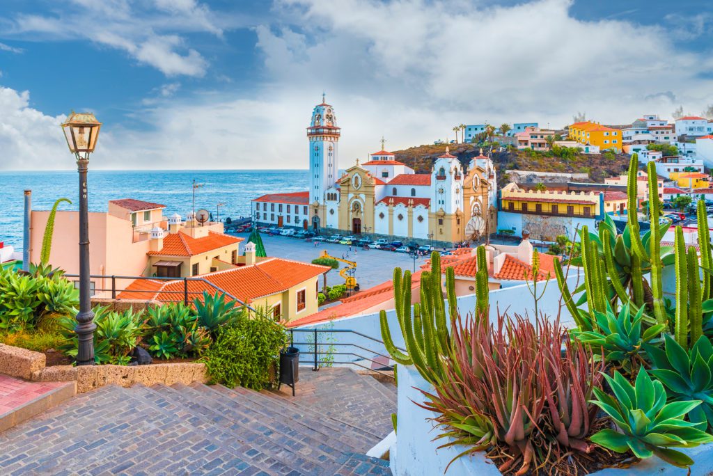 Candelaria, Cuba. Colourful houses back onto a blue sea