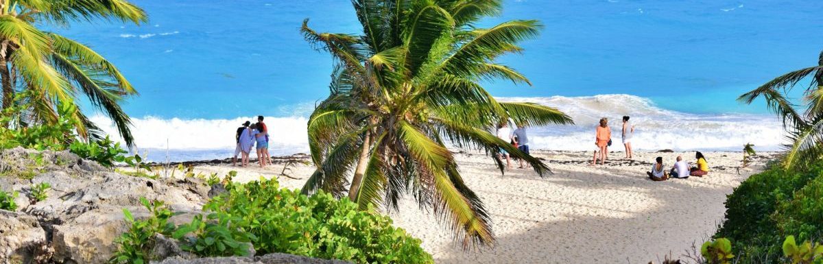 People enjoying the beach in Barbados during the daytime.