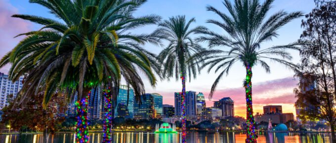 Orlando, Florida, USA downtown skyline at Eola Lake.