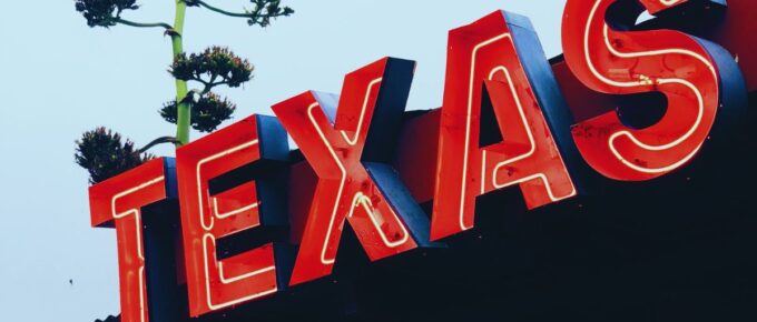 Red Texas all capital letters signage.