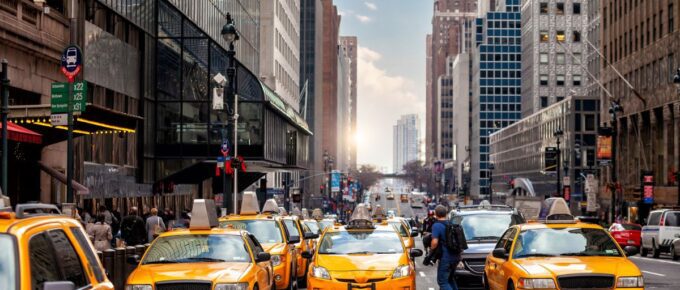 Yellow Taxi in Manhattan, New York City, USA during sunset.