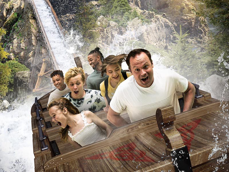 A family on a rollercoaster at Adventureland Park in Iowa.