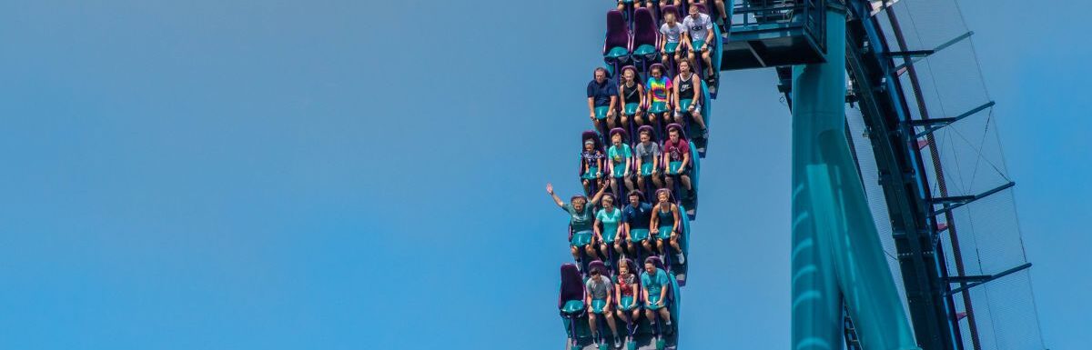People having fun riding Mako rollercoaster during summer vacation at Seaworld, Orlando, Florida, USA.