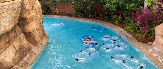 People floating down the lazy river during the day.