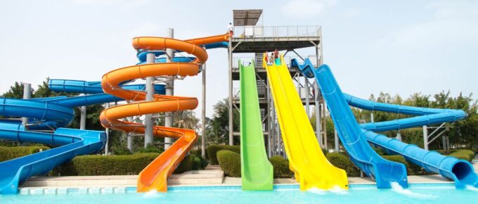 A resort with a waterpark and colorful slides.