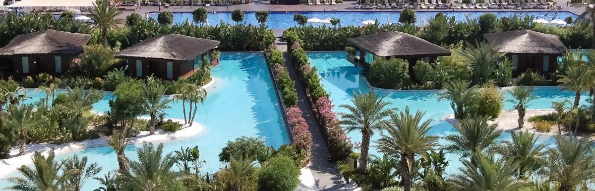 View of the beach line and territory with pools of the luxury hotel Maxx Royal Belek Golf Resort.
