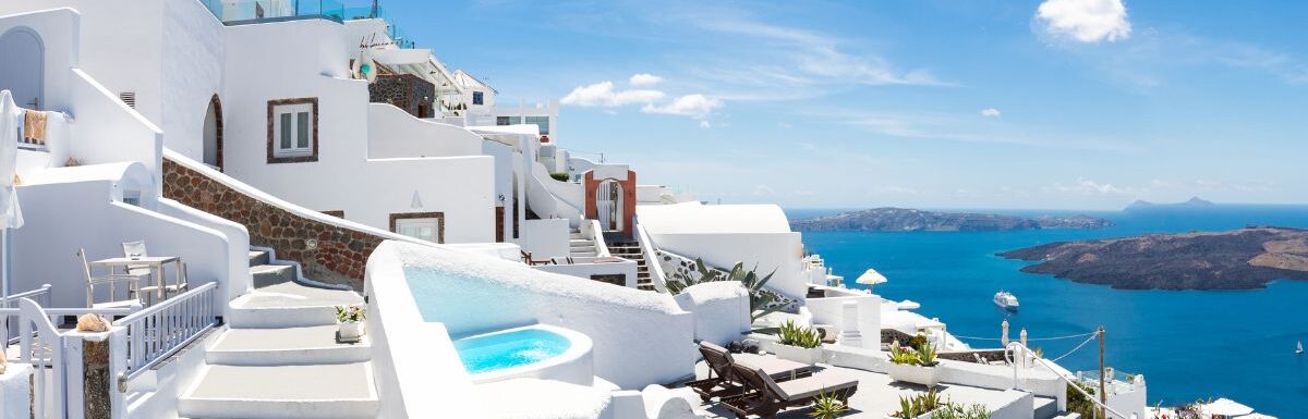 Beautiful panoramic view of picturesque town in Santorini, caldera and volcano on the Mediterranean Sea.