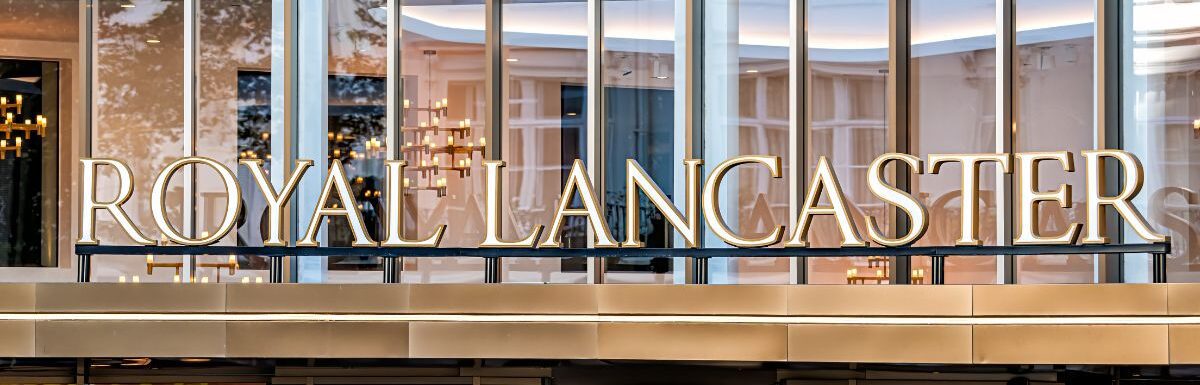 Closeup of sign entrance to the Royal Lancaster hotel with facade exterior modern building architecture in London, UK.